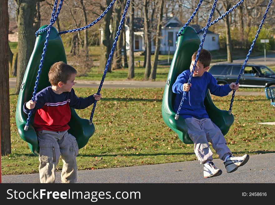 Boys Swinging