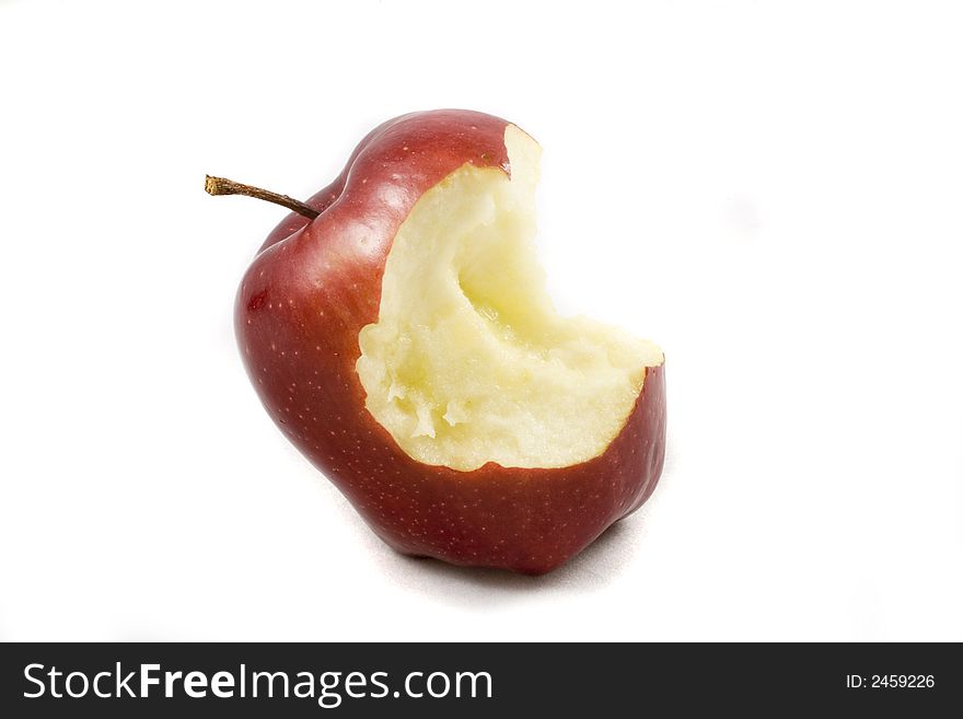 Eating autumn red apple on white background