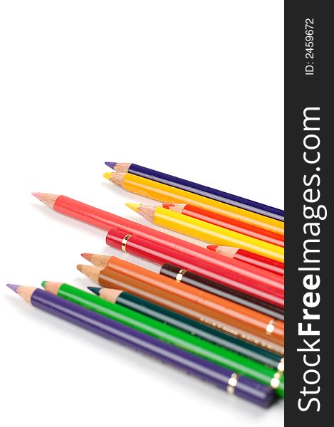 Many colourful pencils fn white background