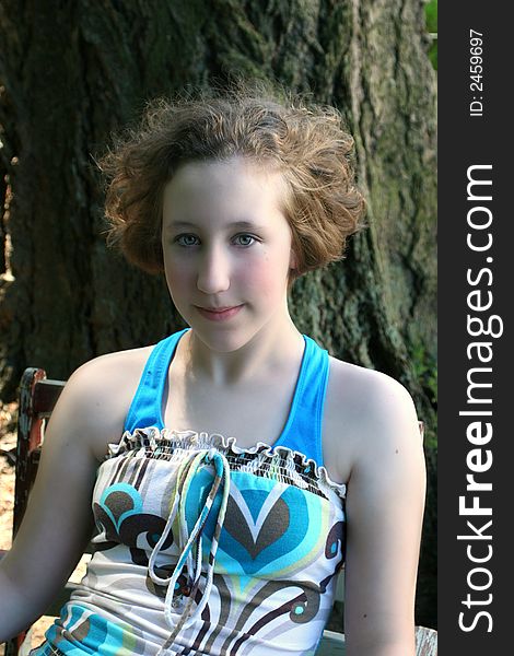 Image of a young teen girl with her hair blowing in the breeze. Image of a young teen girl with her hair blowing in the breeze