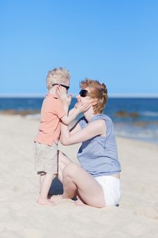 Mother And Son Together At The Beach Stock Photo