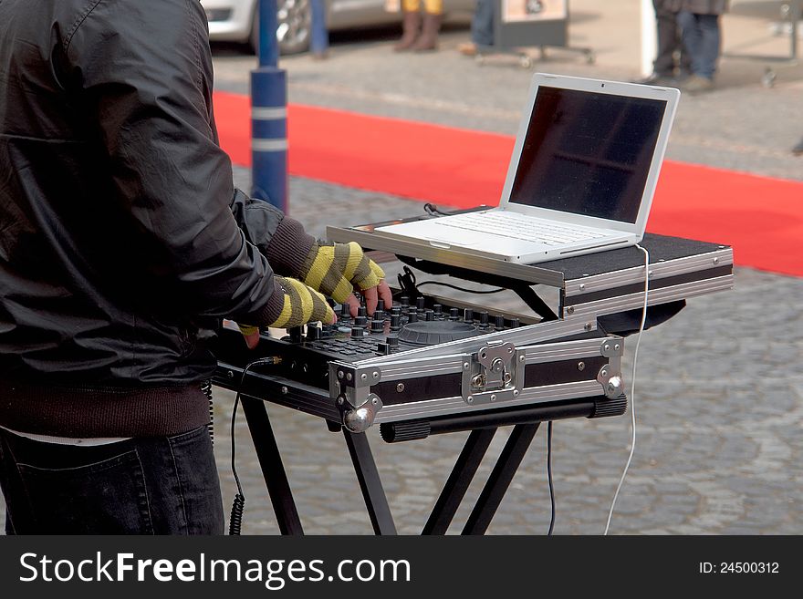 Dj playing disco house progressive electro music in a street party