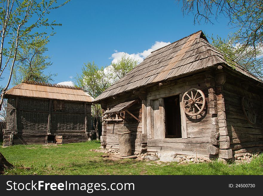 Old traditional wooden house in Romanian rural area in sunny day. Old traditional wooden house in Romanian rural area in sunny day