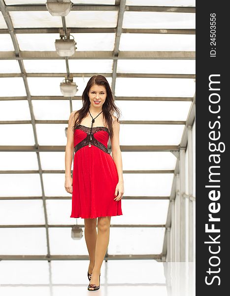 Portrait of young caucasian brunette girl wearing red dress. Portrait of young caucasian brunette girl wearing red dress