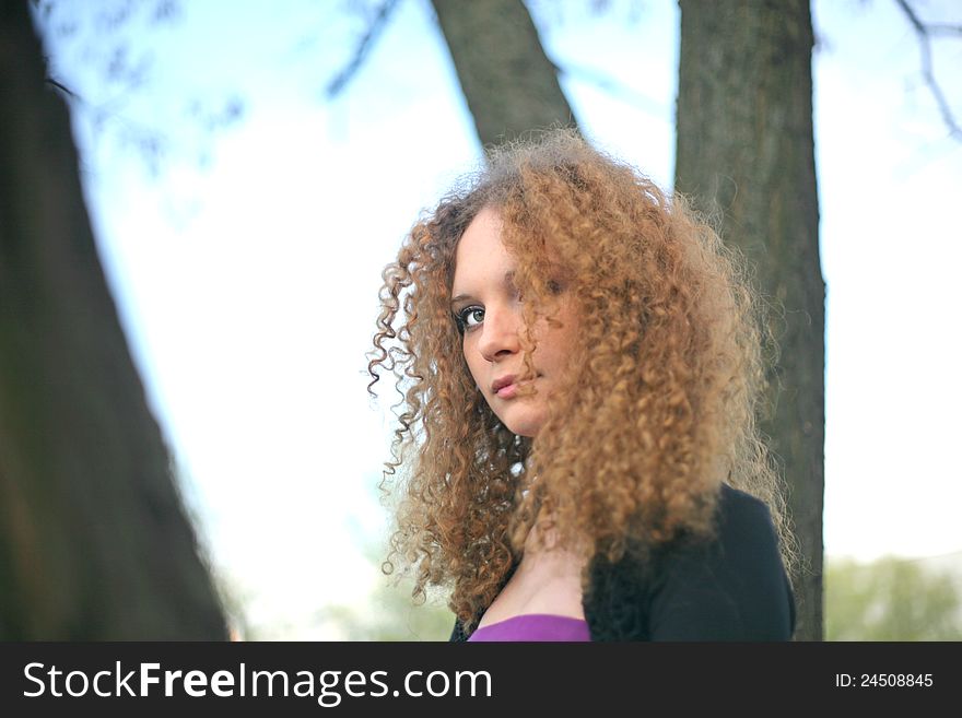 Portrait of a girl in the trees spring