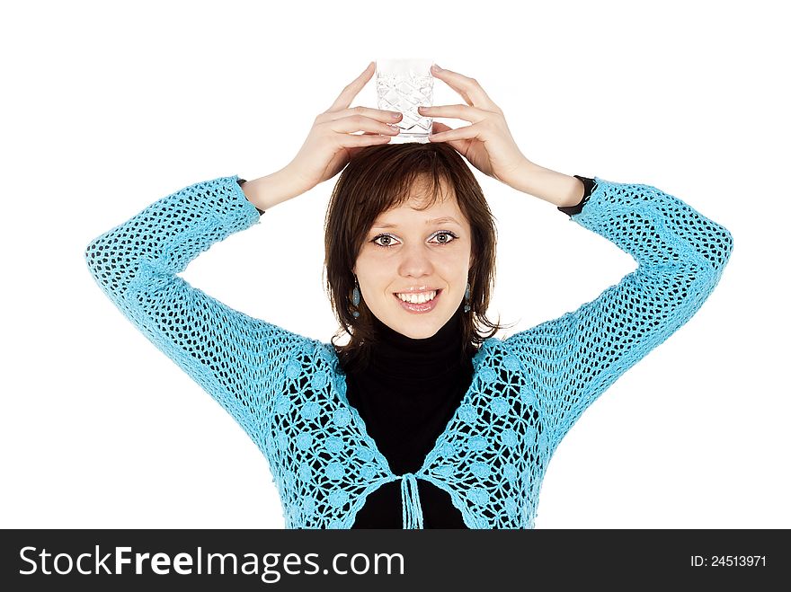 Beautiful girl holds on the head with a glass of water. Beautiful girl holds on the head with a glass of water