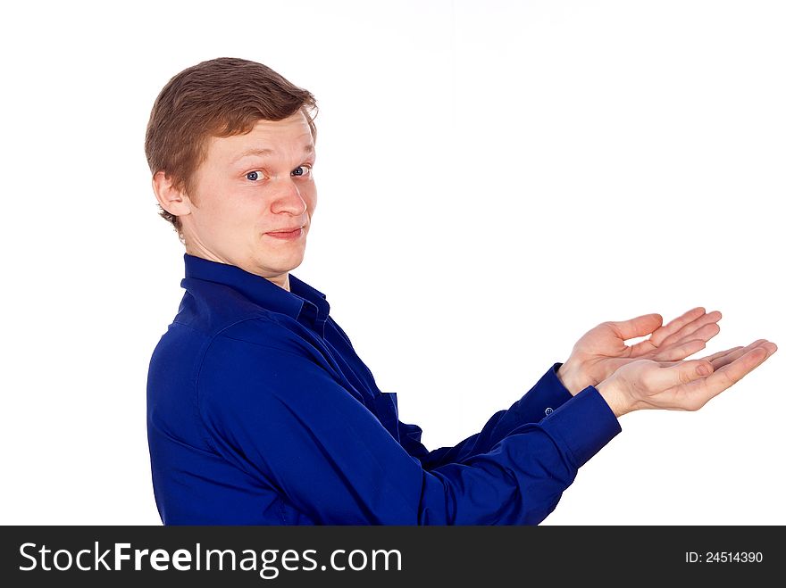 Handsome guy in the blue shirt stretches out his hand. Handsome guy in the blue shirt stretches out his hand