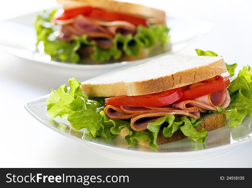 Photgraph of a tasty ham and tomato sandwich. Photgraph of a tasty ham and tomato sandwich