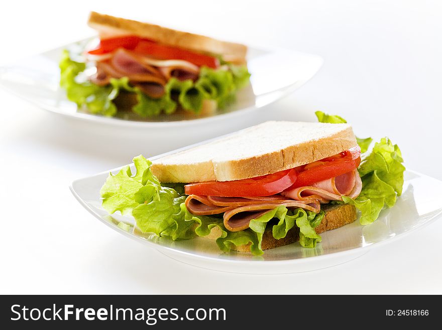 Photgraph of a tasty ham and tomato sandwich. Photgraph of a tasty ham and tomato sandwich