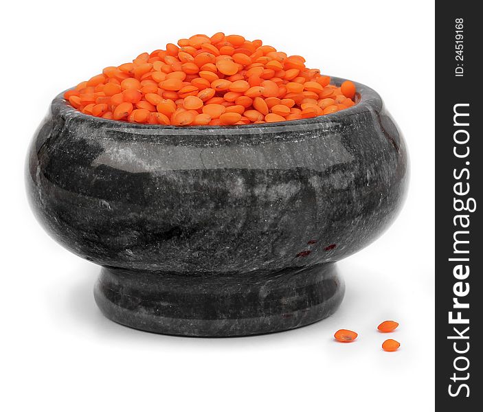 Red lentils in a gray marble mortars