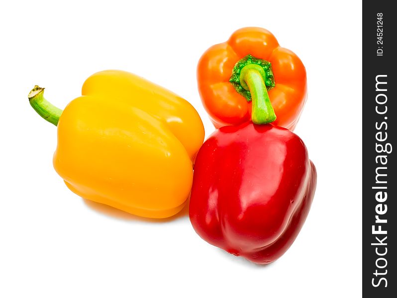 Red, yellow, orange Bulgarian pepper on white background
