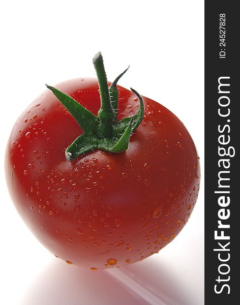 Close up of fresh red tomato  on white. Close up of fresh red tomato  on white