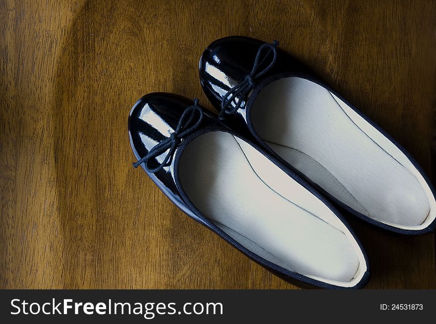 Black shoes on wooden background