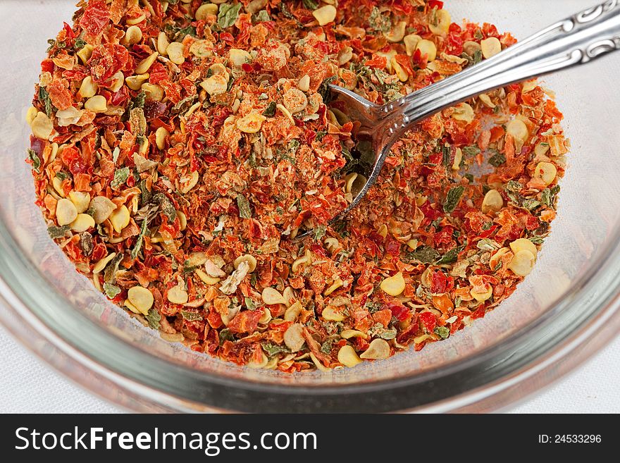 Hot pepper flakes in a bowl. Hot pepper flakes in a bowl