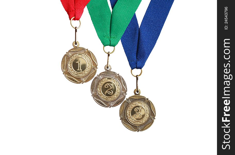 Three medals with colored ribbons isolated on white background with clipping path. Three medals with colored ribbons isolated on white background with clipping path