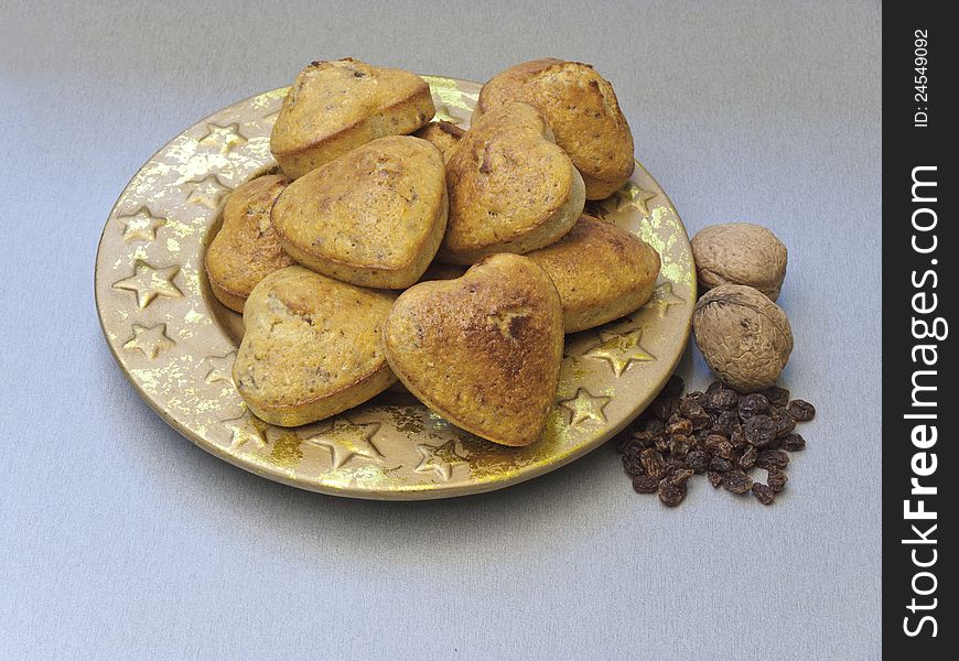 Cakes with raisins and coconut flour in the shape of the heart. Cakes with raisins and coconut flour in the shape of the heart