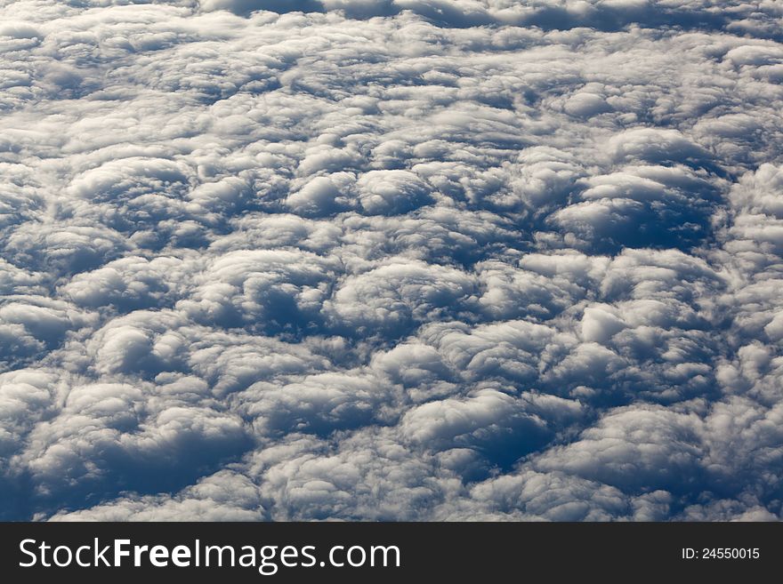 Background texture from clouds seen out of an airplane window. Background texture from clouds seen out of an airplane window