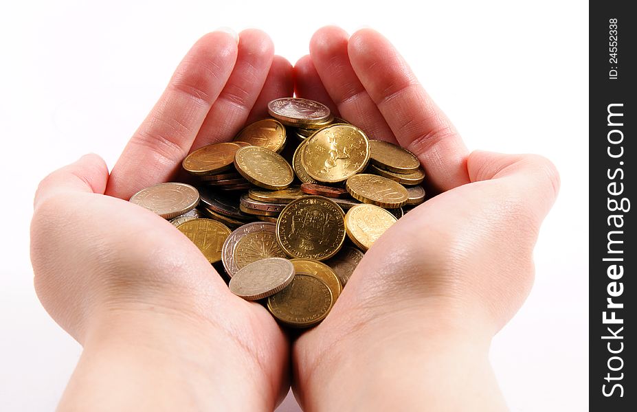 Female hands holding coins isolated. Female hands holding coins isolated
