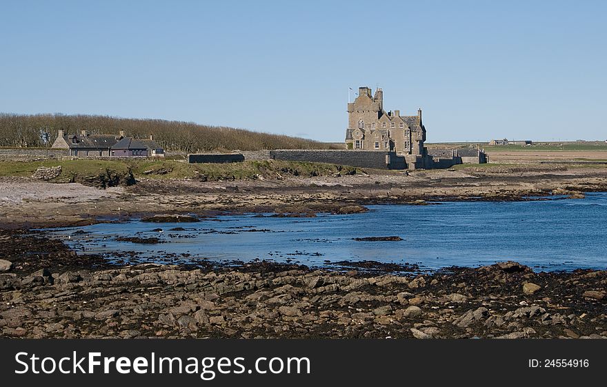 Auchergill Tower, Sinclair Bay, Caithness, Scotland,UK. Taken from the Beach. Ackergill Tower &#x28;or Ackergill Castle&#x29; is located on the coast of Sinclair&#x27;s Bay, about 4 km north of Wick, Caithness, in northern Scotland. It was built in the early 16th century and is a category A listed building. The building is a five-storey oblong tower house. The four-storey wing to the rear was added in the early 18th century. Auchergill Tower, Sinclair Bay, Caithness, Scotland,UK. Taken from the Beach. Ackergill Tower &#x28;or Ackergill Castle&#x29; is located on the coast of Sinclair&#x27;s Bay, about 4 km north of Wick, Caithness, in northern Scotland. It was built in the early 16th century and is a category A listed building. The building is a five-storey oblong tower house. The four-storey wing to the rear was added in the early 18th century.