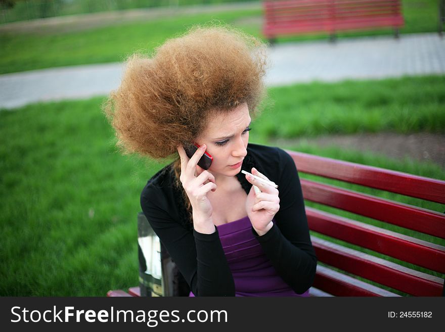 Girl talking on the phone and going through a nervous