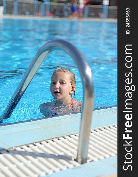 Girl Swimming In Pool