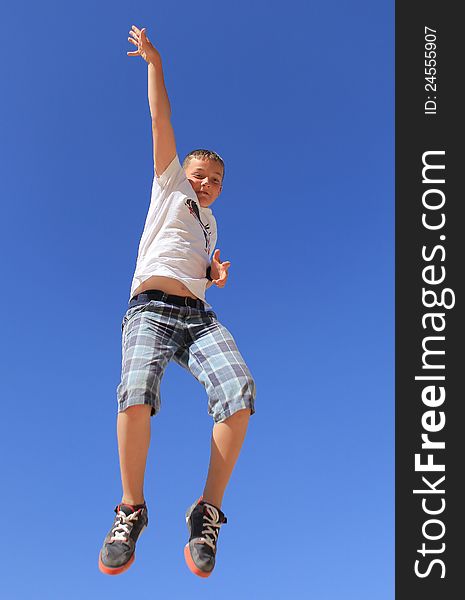 Boy in flight against a clear sky. Boy in flight against a clear sky