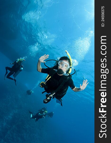 Female scuba diver at the end of her dive. Female scuba diver at the end of her dive