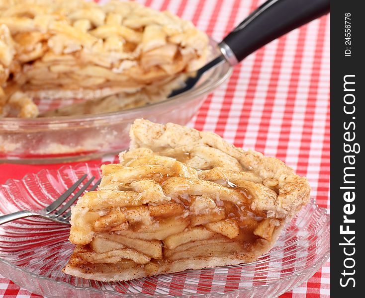 Sliced apple fruit pie on a glass plate