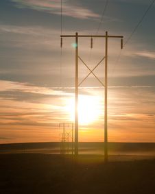 Power Lines Lead Into The Sunset Stock Images