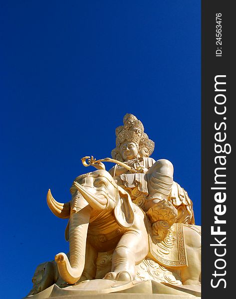 Golden Buddha and eleventh with blue sky of Emei in Sichuan, China.