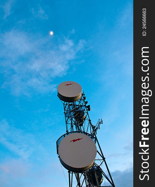 Communications repeater tower rising towards the star above. Communications repeater tower rising towards the star above.