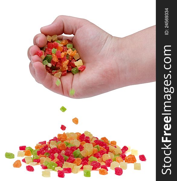 A handful of sweet candied fruit on a white background