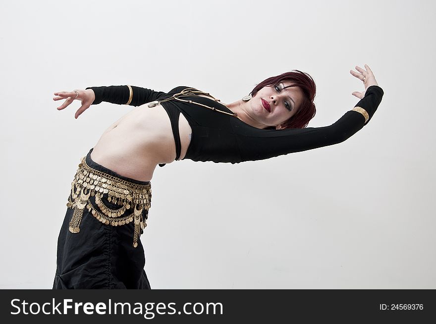 Beautiful tribal dancer with oriental ornament photographed on white background. Beautiful tribal dancer with oriental ornament photographed on white background