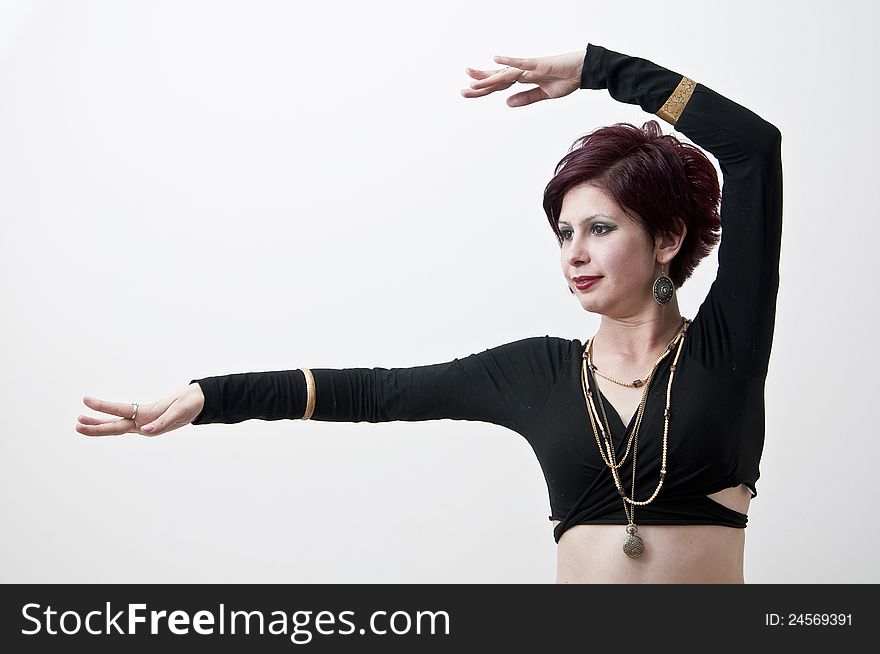 Beautiful tribal dancer with oriental ornament photographed on white background. Beautiful tribal dancer with oriental ornament photographed on white background