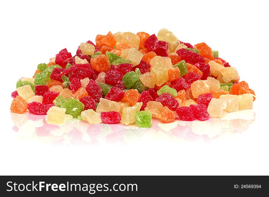 A handful of colorful sweet candied fruit on a white background. A handful of colorful sweet candied fruit on a white background