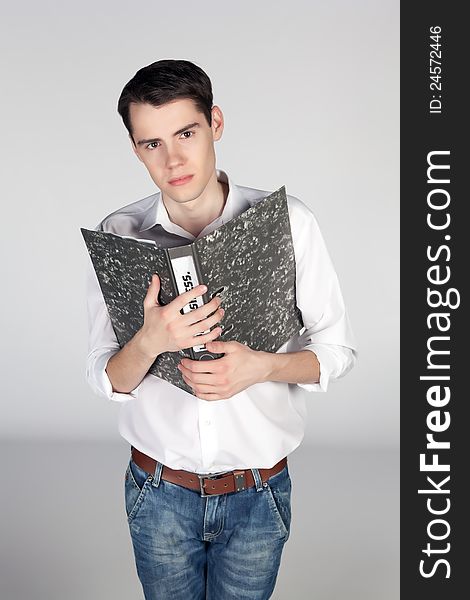Young man with an office folder on white background