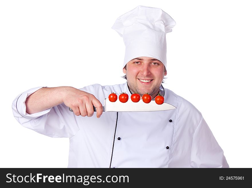 Men cook. cherry tomatoes cut into the knife