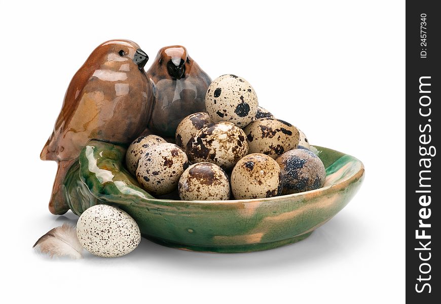 Quail eggs in an antiquarian ceramic dish. Quail eggs in an antiquarian ceramic dish