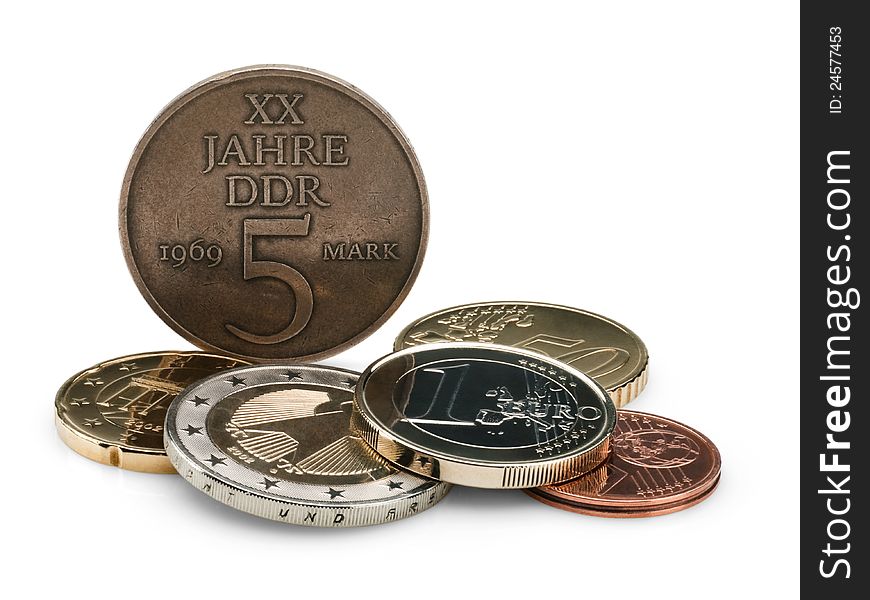 Coins of GDR (DDR) and the European union on a white background. Coins of GDR (DDR) and the European union on a white background.