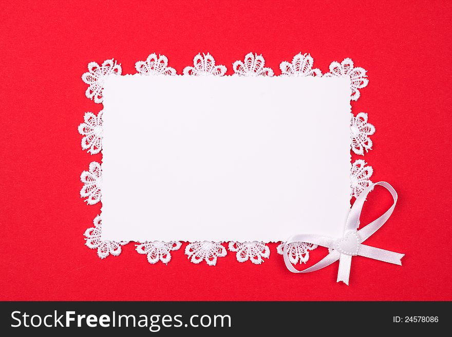 White card for congratulation on a background from red backgound