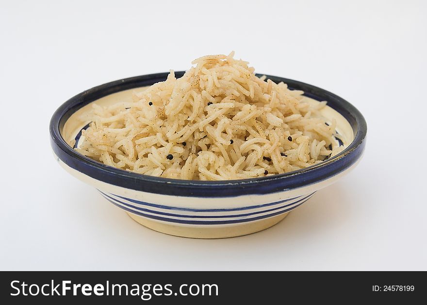 Little plate of basmati rice cooked with grains of charlock. Little plate of basmati rice cooked with grains of charlock