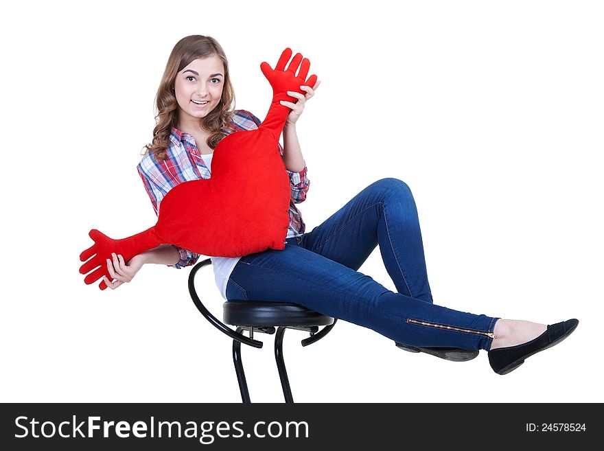 Beautiful girl with A red plush heart, isolate on white