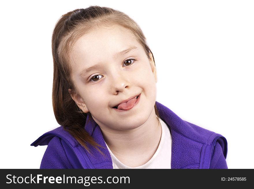 Little funny girl with her tongue out, isolated on white background