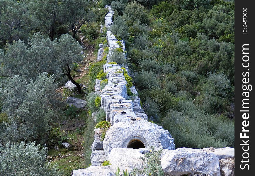 Shows walls and top of the Roman Aquaduct on the Lycian Way near Patara, Turkey. Shows walls and top of the Roman Aquaduct on the Lycian Way near Patara, Turkey