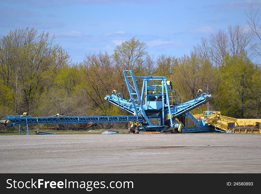 Large industrial machinery in open field.