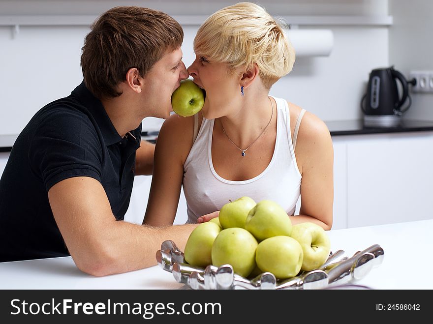 Happy couple posing in the kitchen