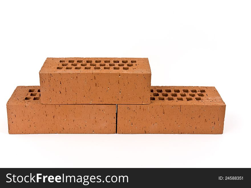 Three bricks on a white background shown.