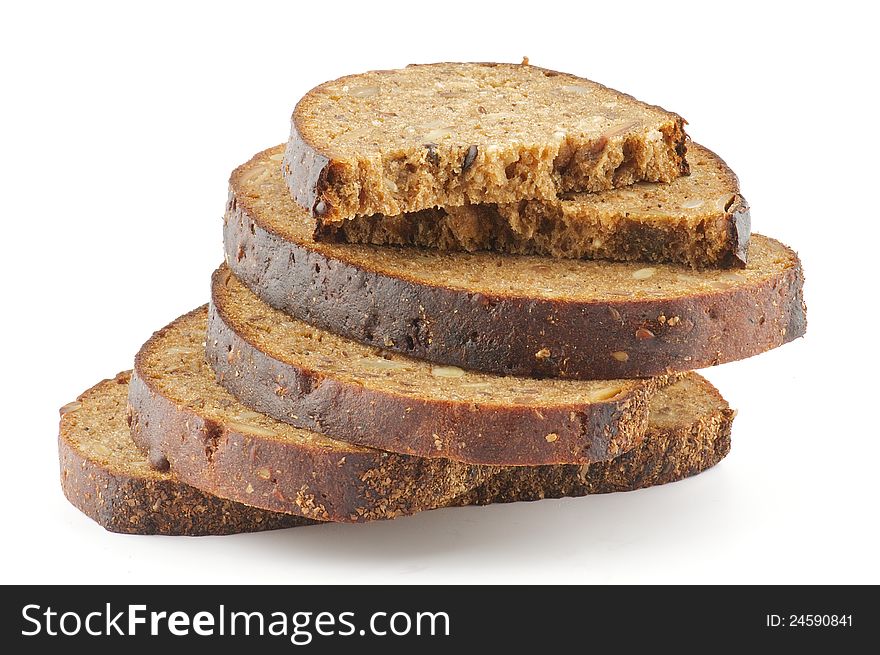 Slices of whole wheat brown bread isolated on white background. Slices of whole wheat brown bread isolated on white background