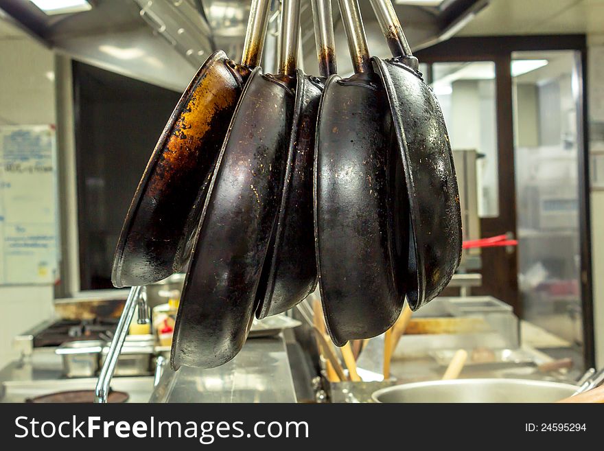 Hanging the pans in the kitchen