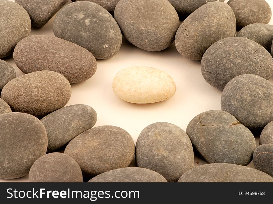 Closup of white stone surrounded by grey stones